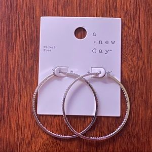 a new day Hoop Earrings